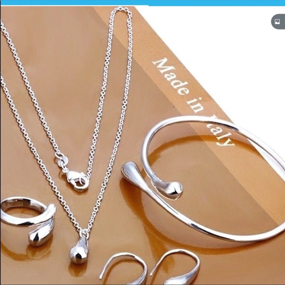 Sterling Silver Teardrop Earrings by - Polished Silver Finish